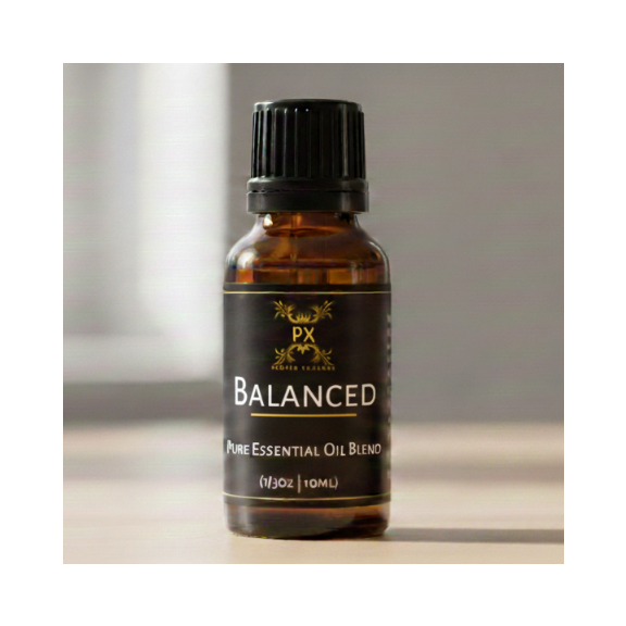 Balanced essential oil bottle on a neutral background