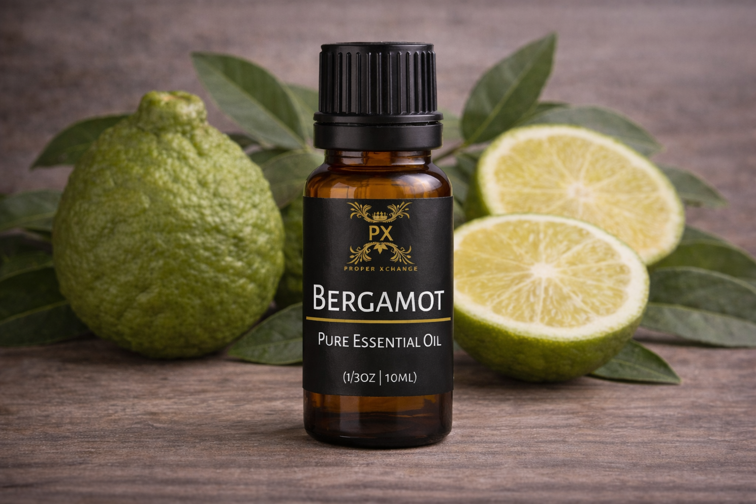 Bottle of Bergamot pure essential oil with bergamot fruit on a wooden surface