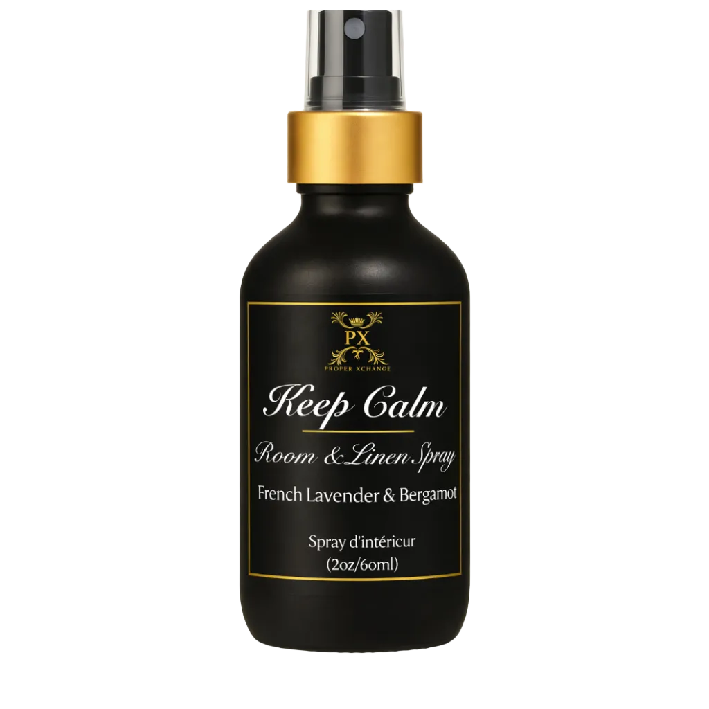 Black room & linen spray bottle with gold cap and label on a white background