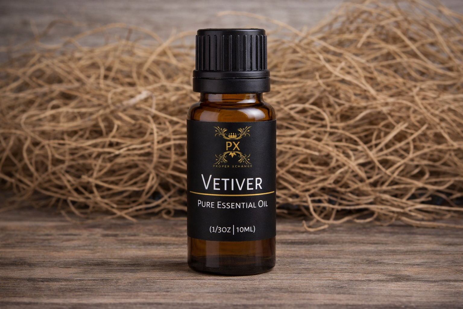 Bottle of PX Vetiver pure essential oil on a wooden surface with straw in the background