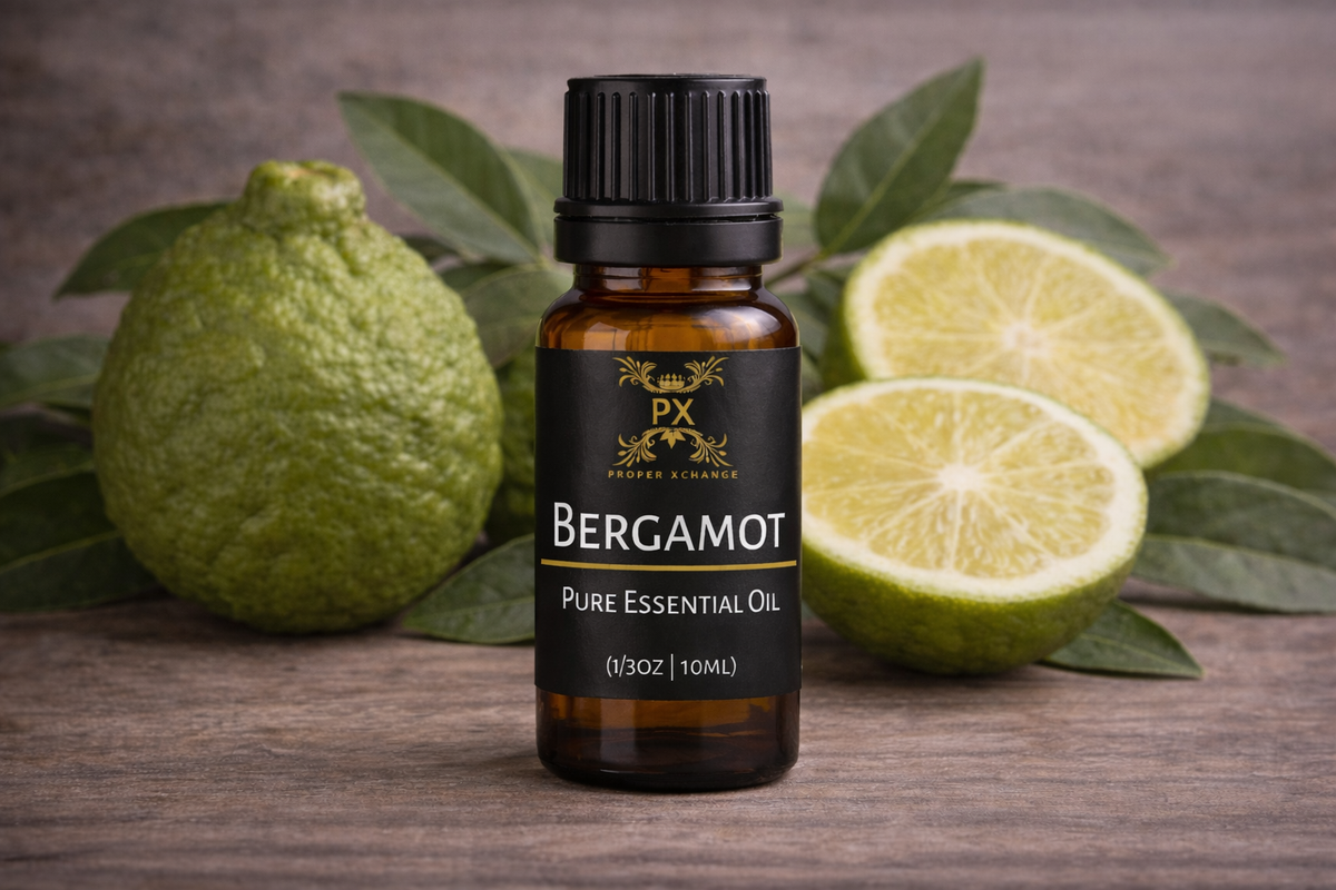 Bottle of Bergamot pure essential oil with bergamot fruit on a wooden surface