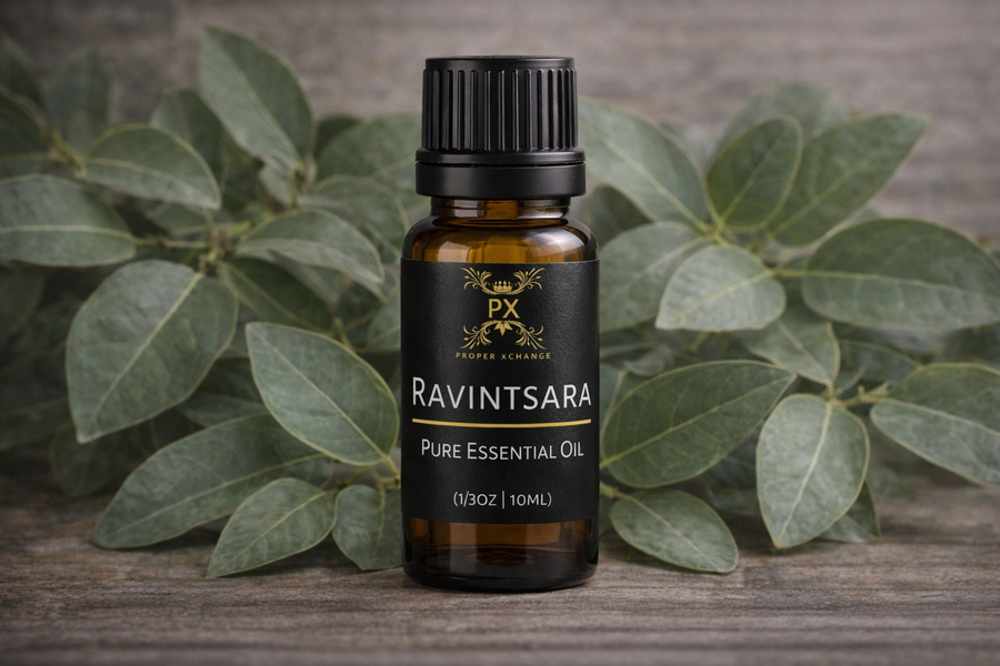PX Ravintsara pure essential oil bottle with green leaves in the background