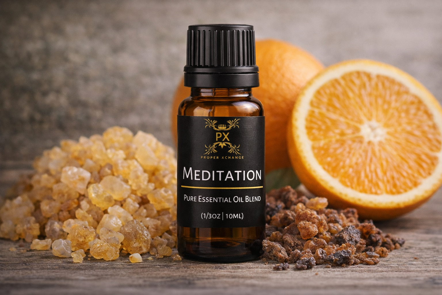 PX Meditation essential oil blend bottle with oranges and frankincense resin on a wooden surface