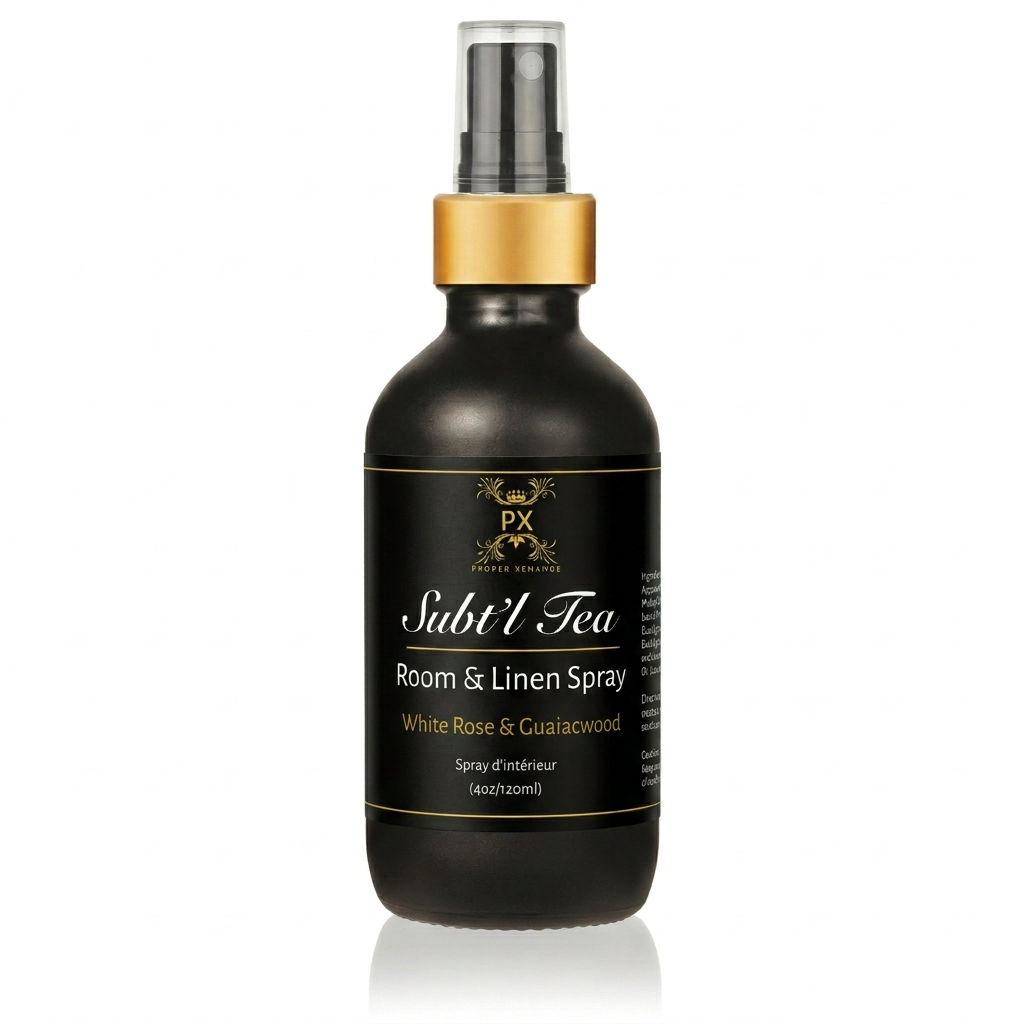 Black room and linen spray bottle with gold cap on a white background