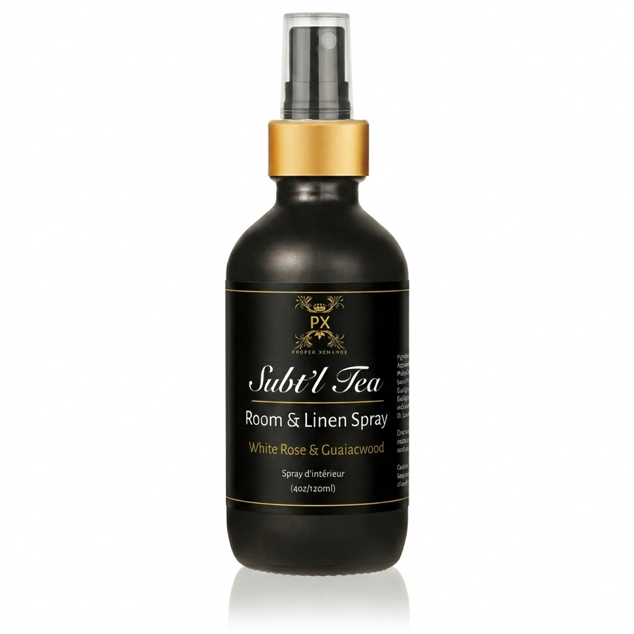 Black room and linen spray bottle with gold cap on a white background